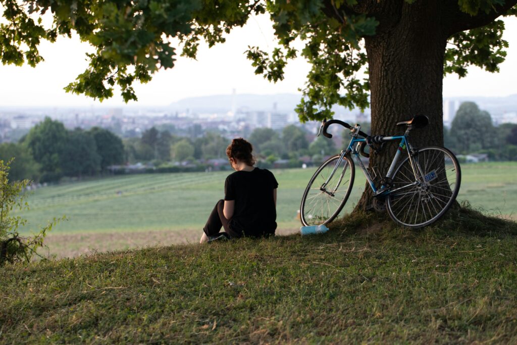 person reflecting alone in nature representing conscious living and awareness